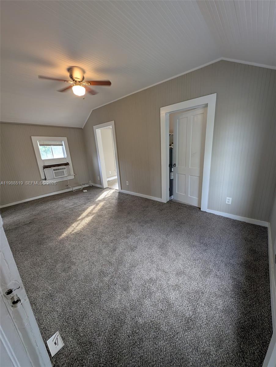 700 Boston Avenue, Unit B Fort Pierce, FL 34950 - Photo 1 of 12 a view of an empty room with a chandelier fan