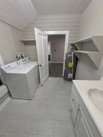 a utility room with cabinets