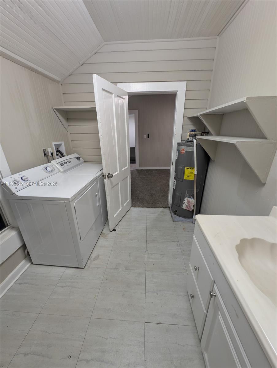 700 Boston Avenue, Unit B Fort Pierce, FL 34950 - Photo 12 of 12 a utility room with cabinets