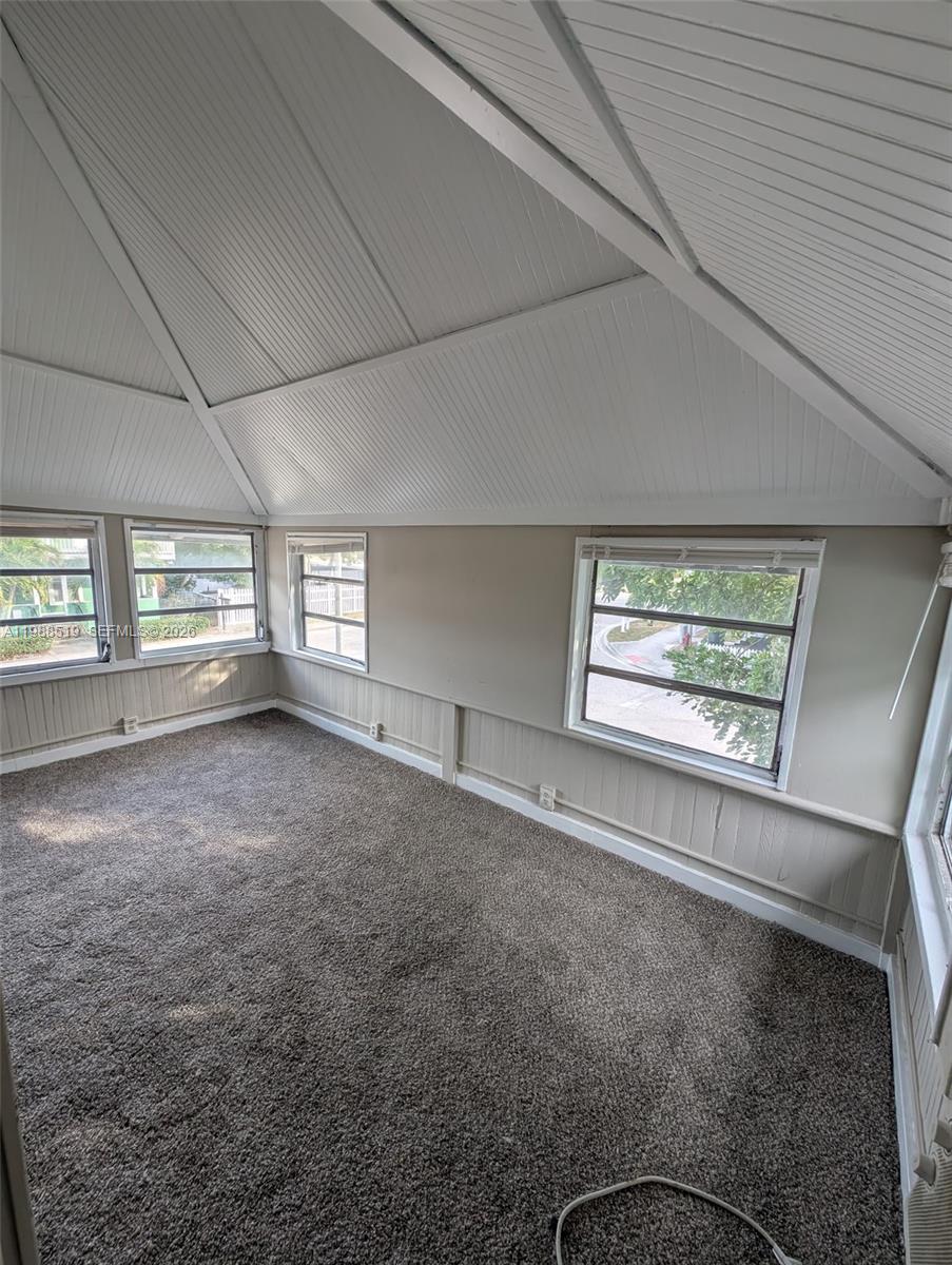 700 Boston Avenue, Unit B Fort Pierce, FL 34950 - Photo 2 of 12 an empty room with windows