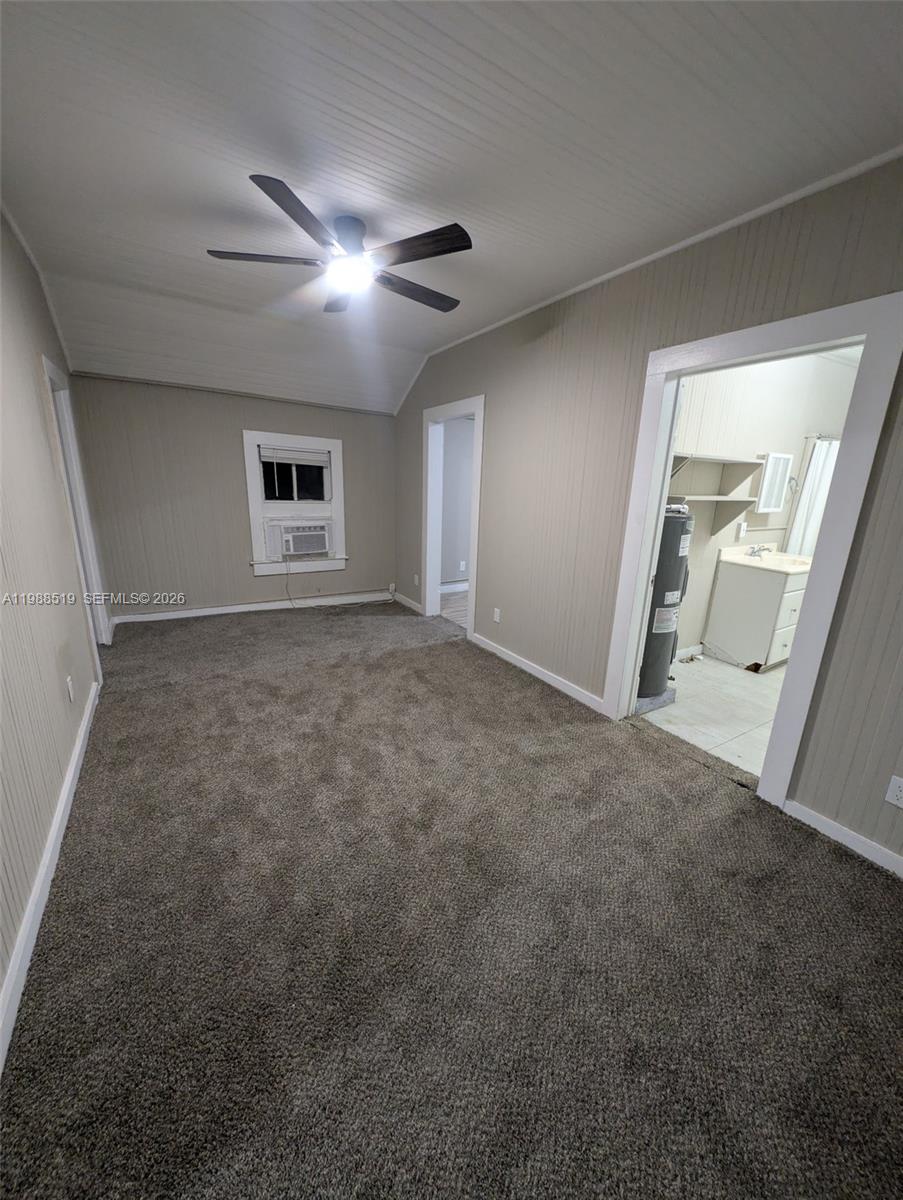 700 Boston Avenue, Unit B Fort Pierce, FL 34950 - Photo 8 of 12 a view of a livingroom with a ceiling fan and window