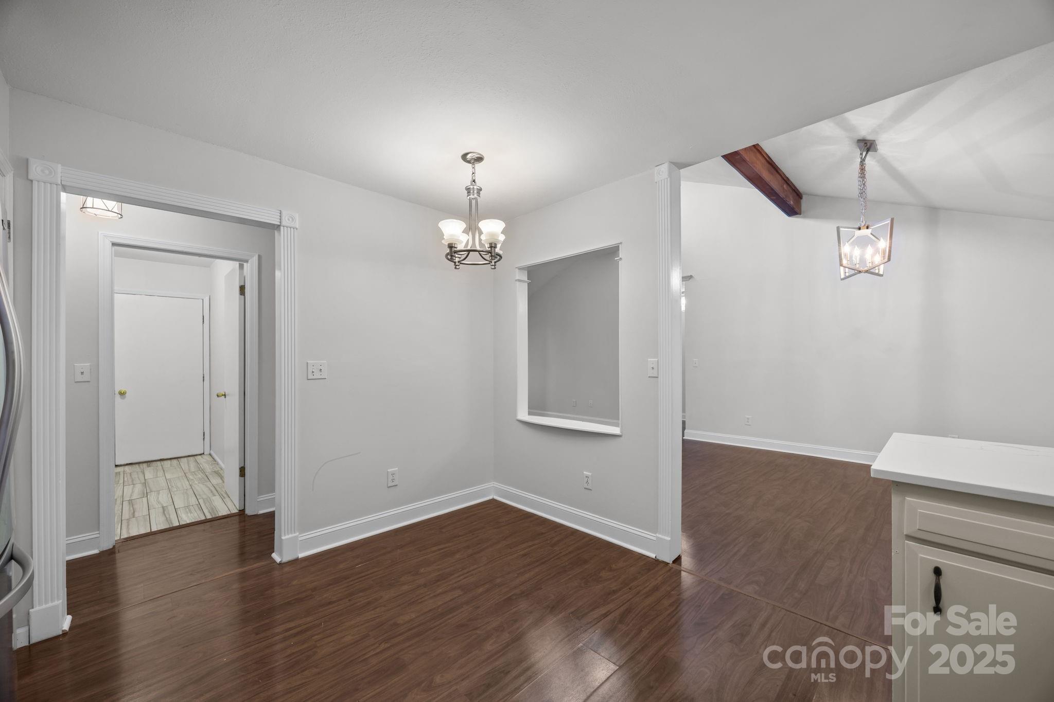 17 Berry Lane Fletcher, NC 28732 - Photo 17 of 47 an empty room with wooden floor and mirror