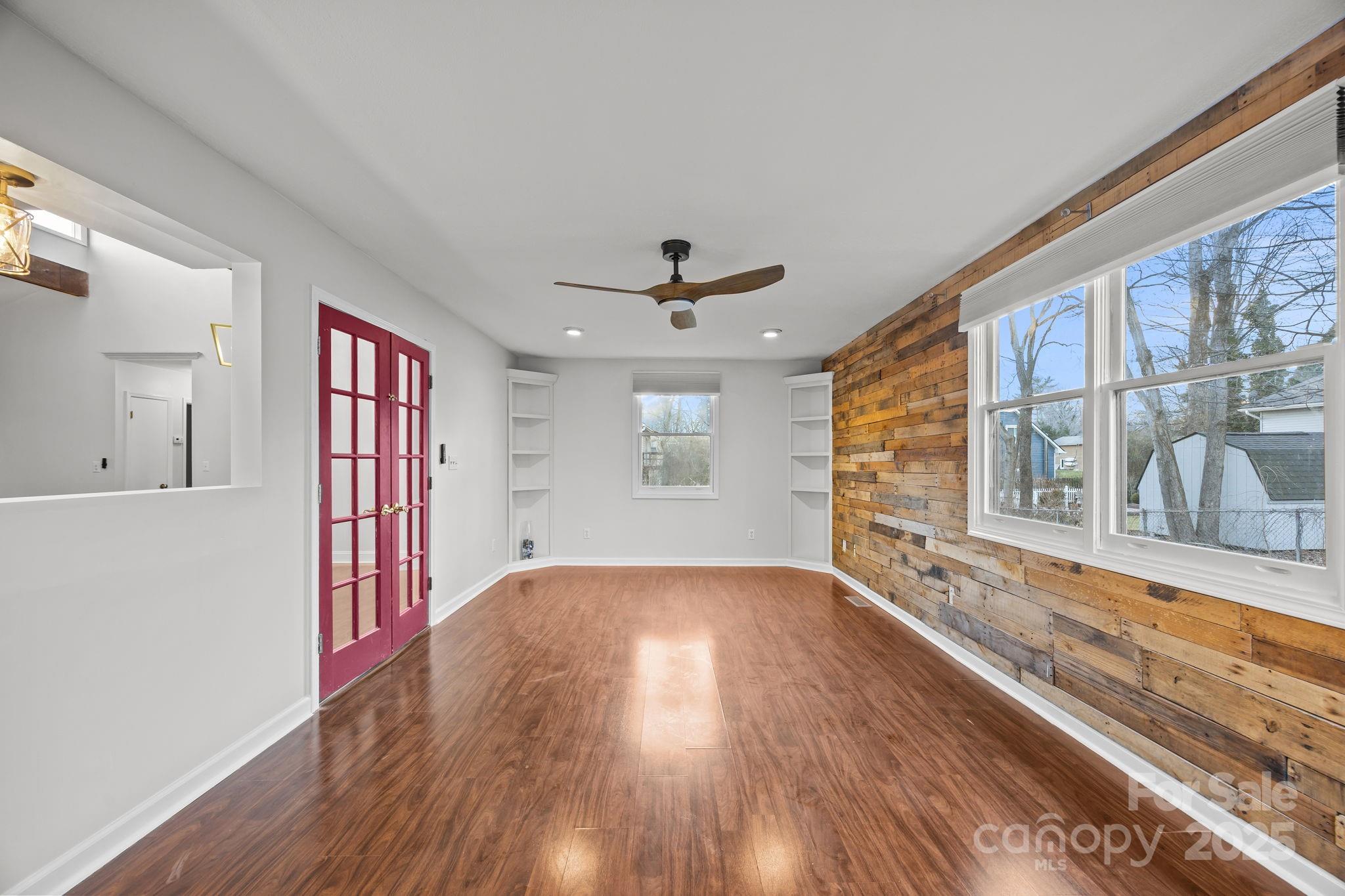 17 Berry Lane Fletcher, NC 28732 - Photo 18 of 47 a view of an empty room with wooden floor and a window
