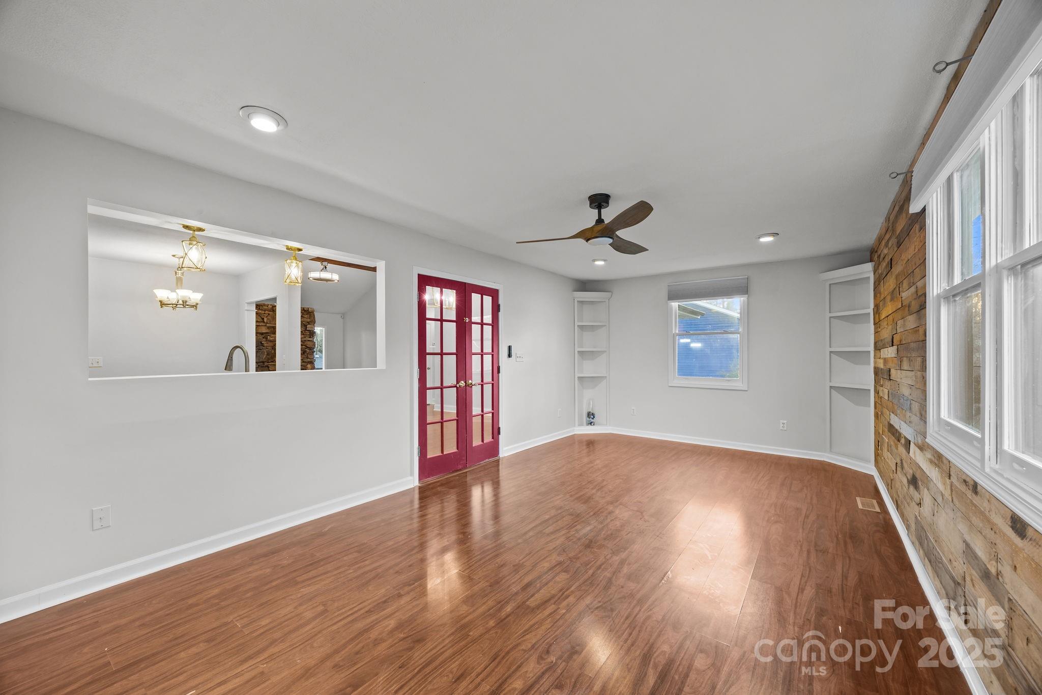 17 Berry Lane Fletcher, NC 28732 - Photo 20 of 47 wooden floor in an empty room with a window