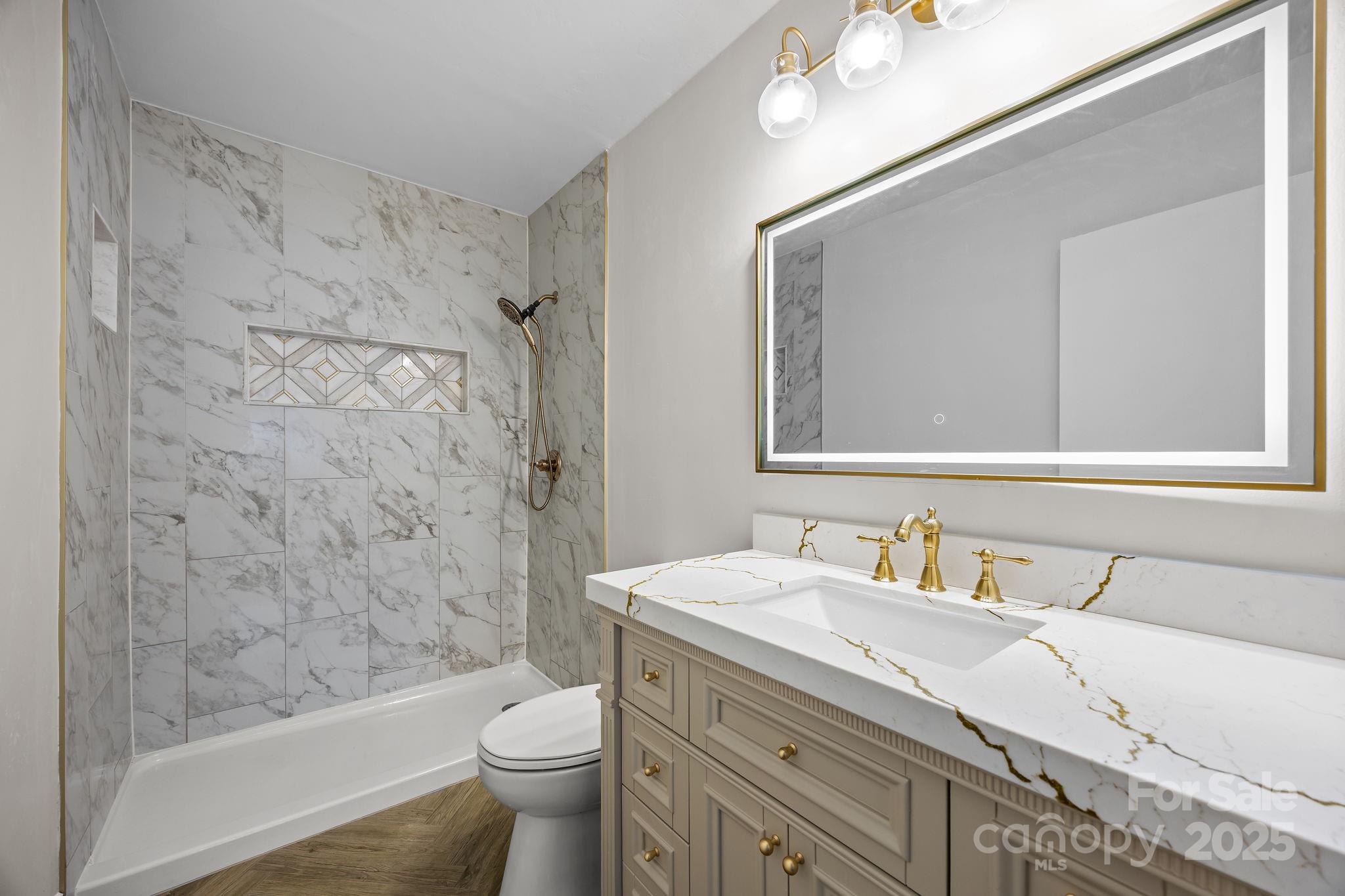 17 Berry Lane Fletcher, NC 28732 - Photo 22 of 47 a bathroom with a sink toilet and shower