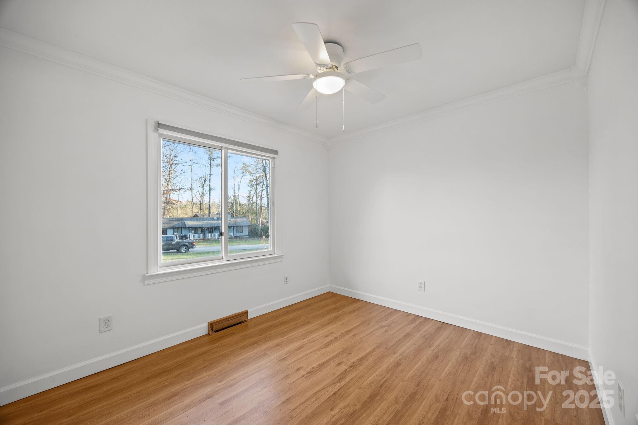 17 Berry Lane Fletcher, NC 28732 - Photo 23 of 47 an empty room with wooden floor and windows