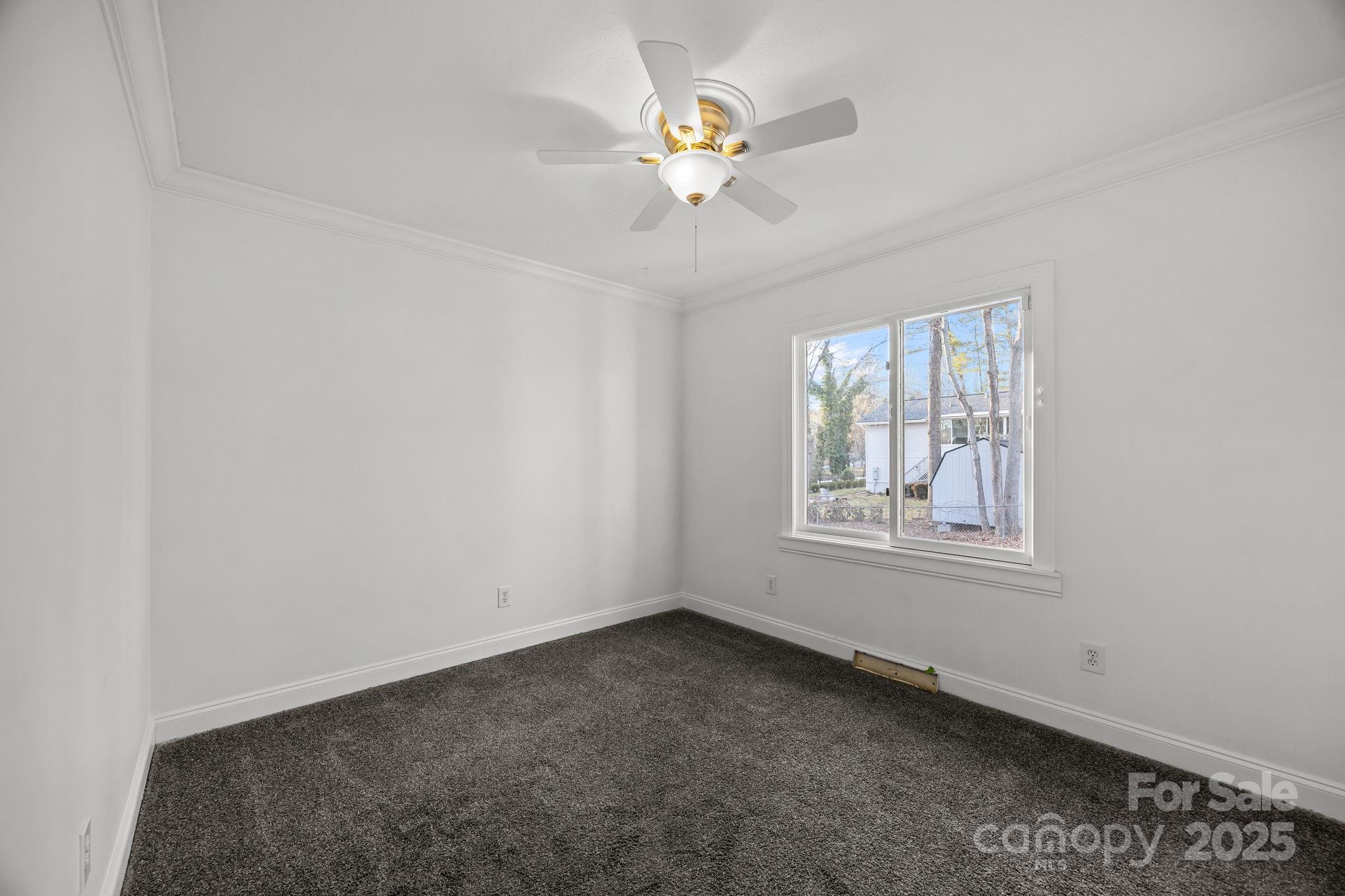 17 Berry Lane Fletcher, NC 28732 - Photo 25 of 47 an empty room with a window and a fan