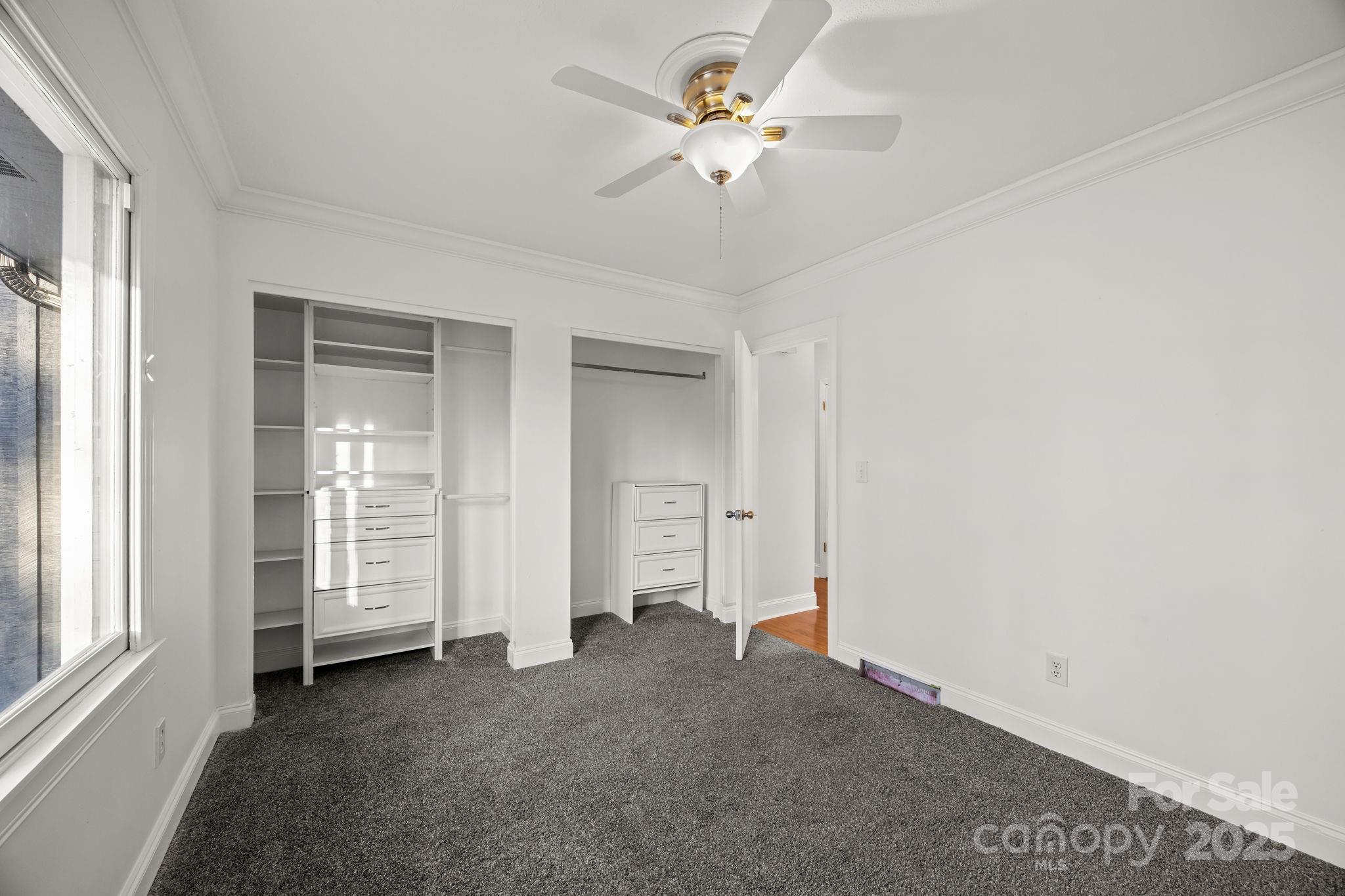 17 Berry Lane Fletcher, NC 28732 - Photo 26 of 47 an empty room with windows and fan