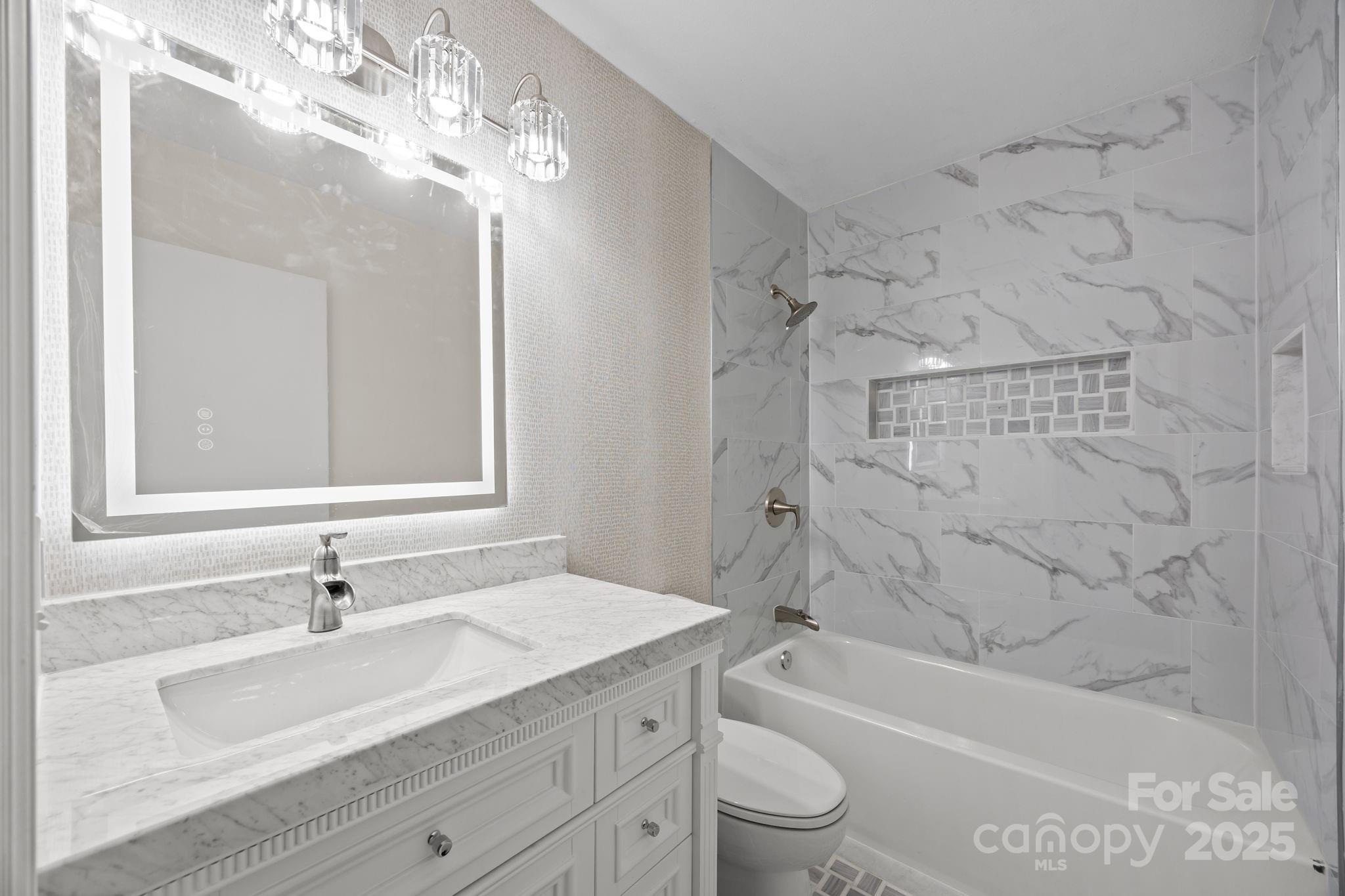 17 Berry Lane Fletcher, NC 28732 - Photo 27 of 47 a bathroom with a sink a toilet and a bathtub