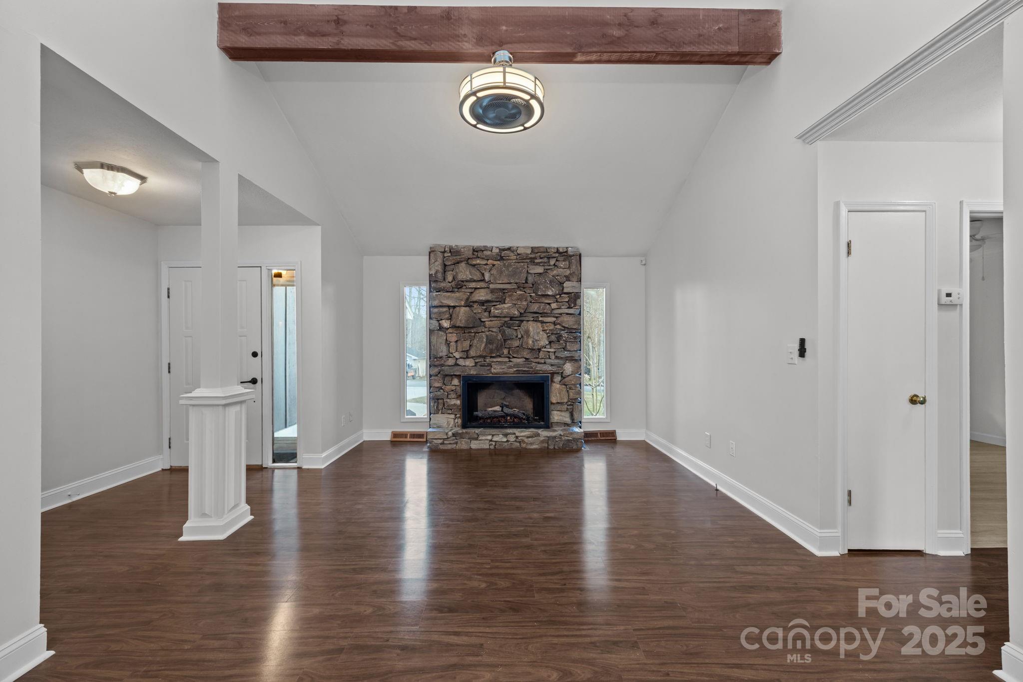 17 Berry Lane Fletcher, NC 28732 - Photo 3 of 47 a view of an empty room with wooden floor and a fireplace