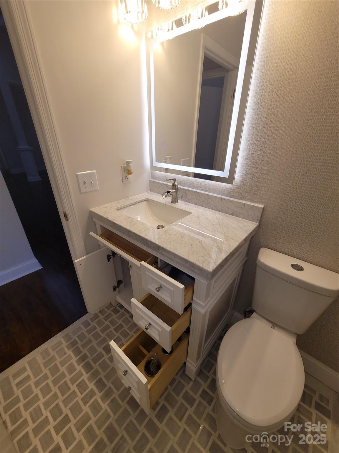 17 Berry Lane Fletcher, NC 28732 - Photo 31 of 47 a bathroom with a sink toilet and mirror