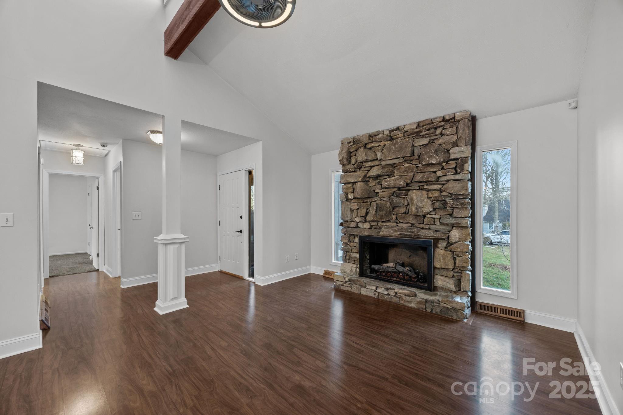 17 Berry Lane Fletcher, NC 28732 - Photo 4 of 47 a view of a livingroom with wooden floor a fireplace and window
