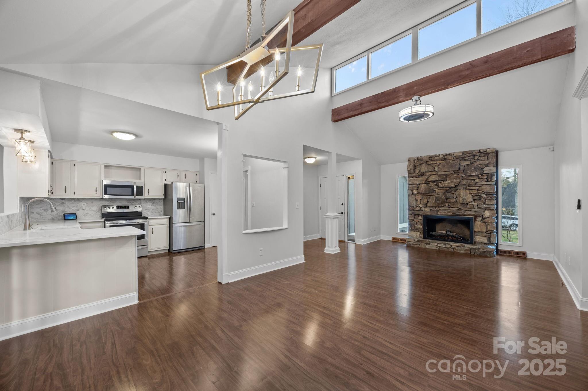 17 Berry Lane Fletcher, NC 28732 - Photo 6 of 47 a open kitchen view with stainless steel appliances cabinets and wooden floor