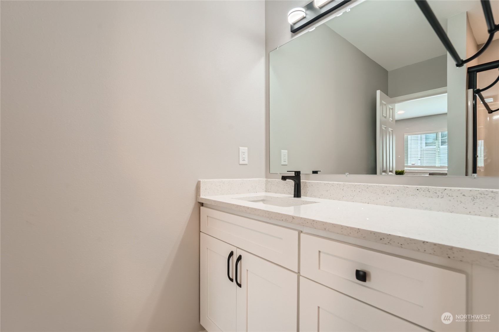 11409 Southeast 177th Place Renton, WA 98055 - Photo 13 of 27 a bathroom with a sink and a mirror