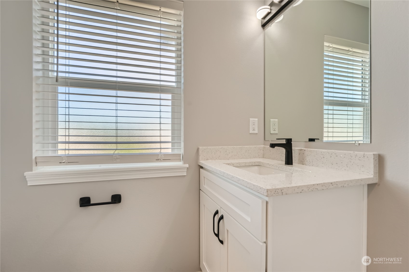11409 Southeast 177th Place Renton, WA 98055 - Photo 17 of 27 a bathroom with a sink and a window