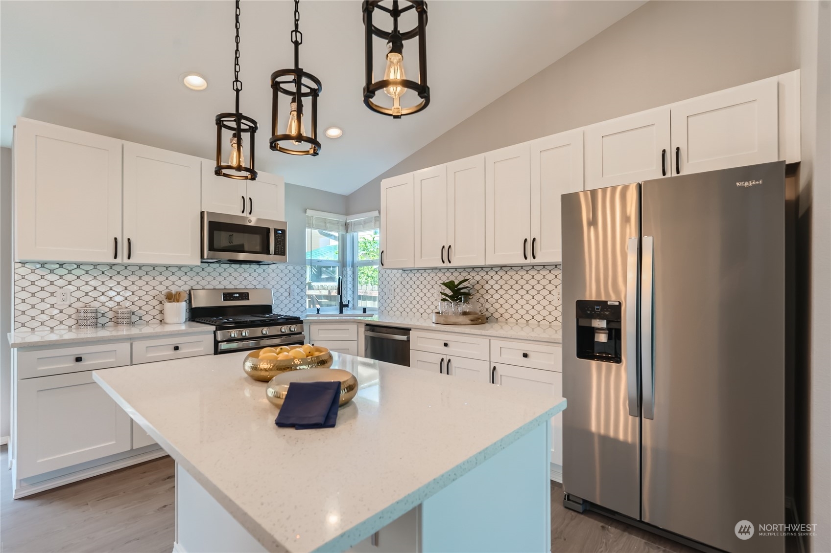 11409 Southeast 177th Place Renton, WA 98055 - Photo 8 of 27 a kitchen with refrigerator cabinets and furniture