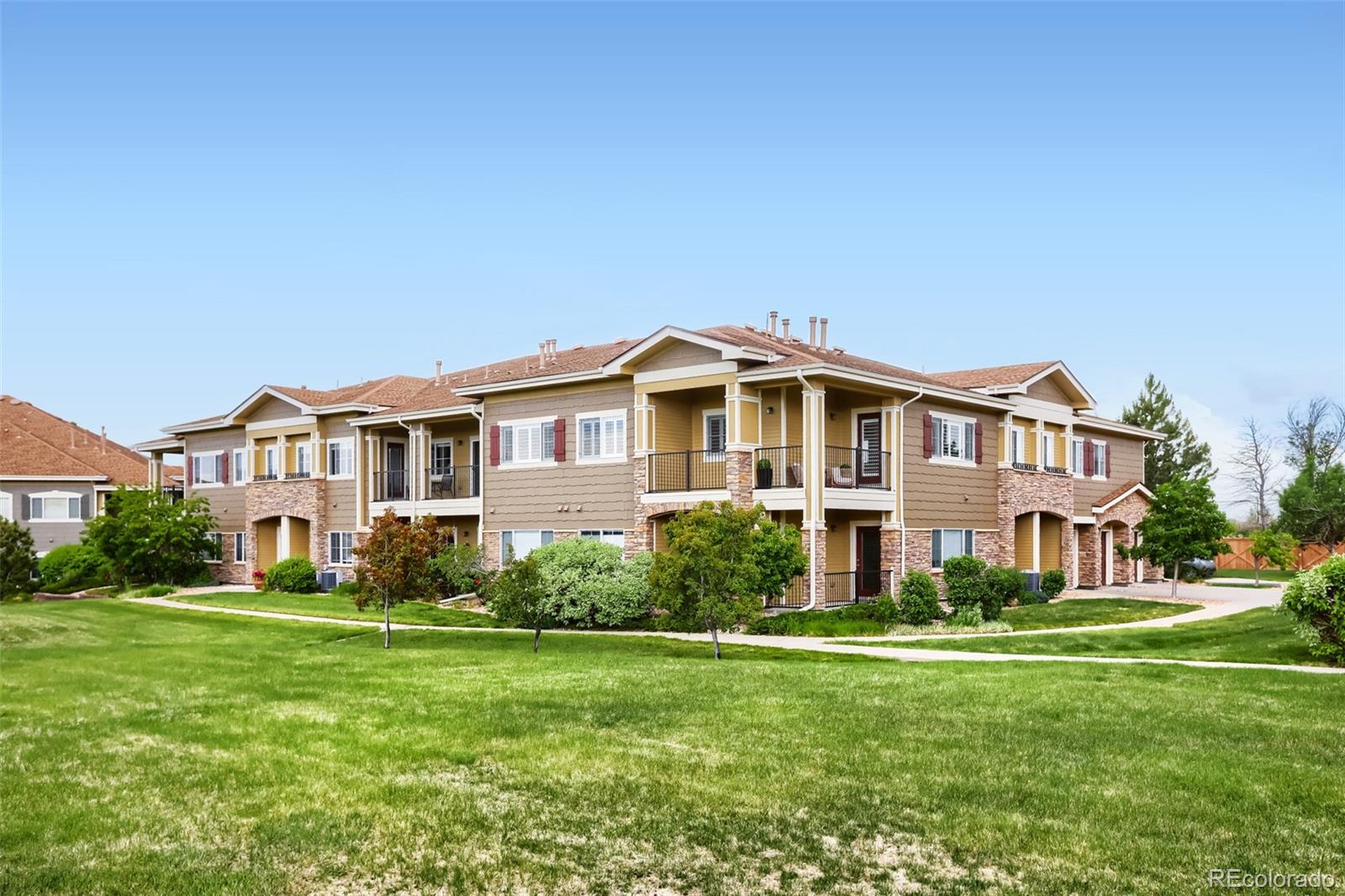 6232 Kilmer Loop, Unit 203 Golden, CO 80403 - Photo 27 of 33 a front view of a house with a garden