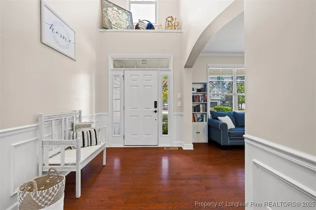 a view of livingroom with furniture and workspace