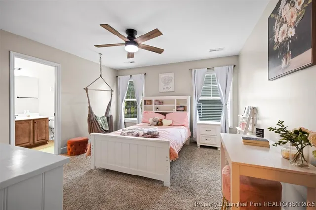 a bed room with a bed window and flowerpot