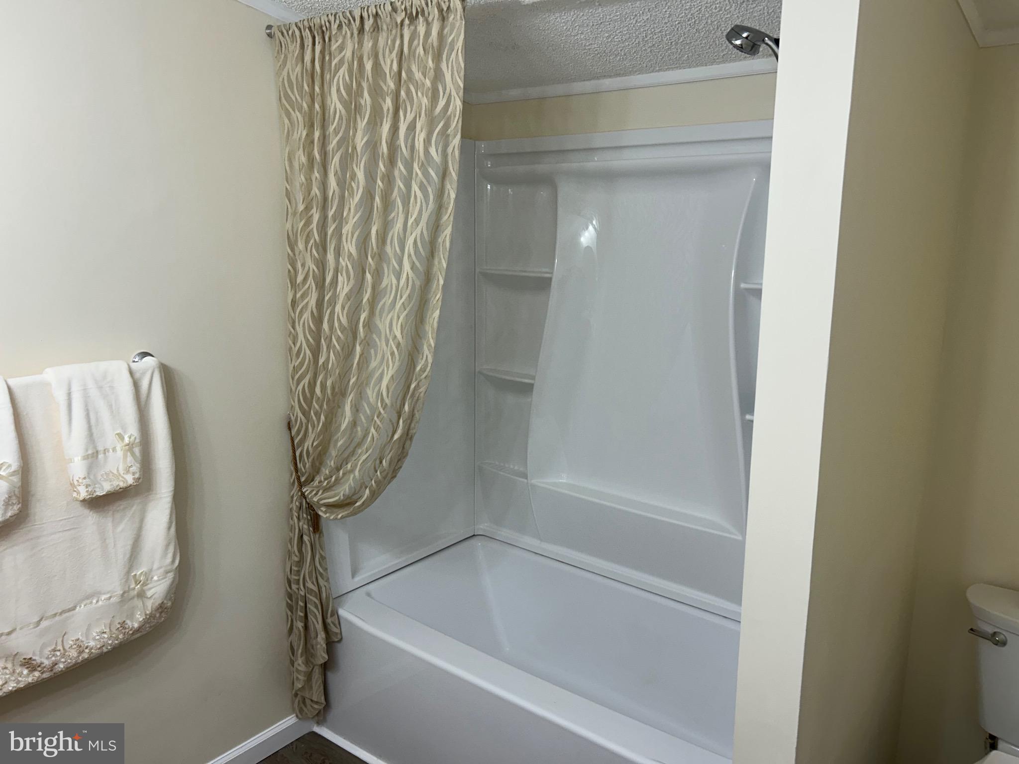 2139 Meredith Way, Unit A679 Bear, DE 19701 - Photo 12 of 38 a bathroom with a bathtub