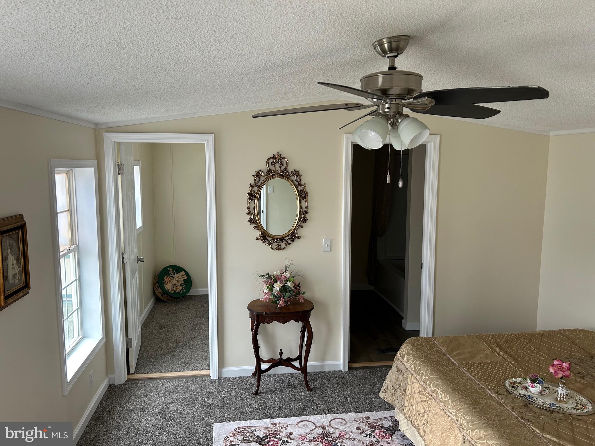 2139 Meredith Way, Unit A679 Bear, DE 19701 - Photo 14 of 38 a bedroom with a bed and a chandelier