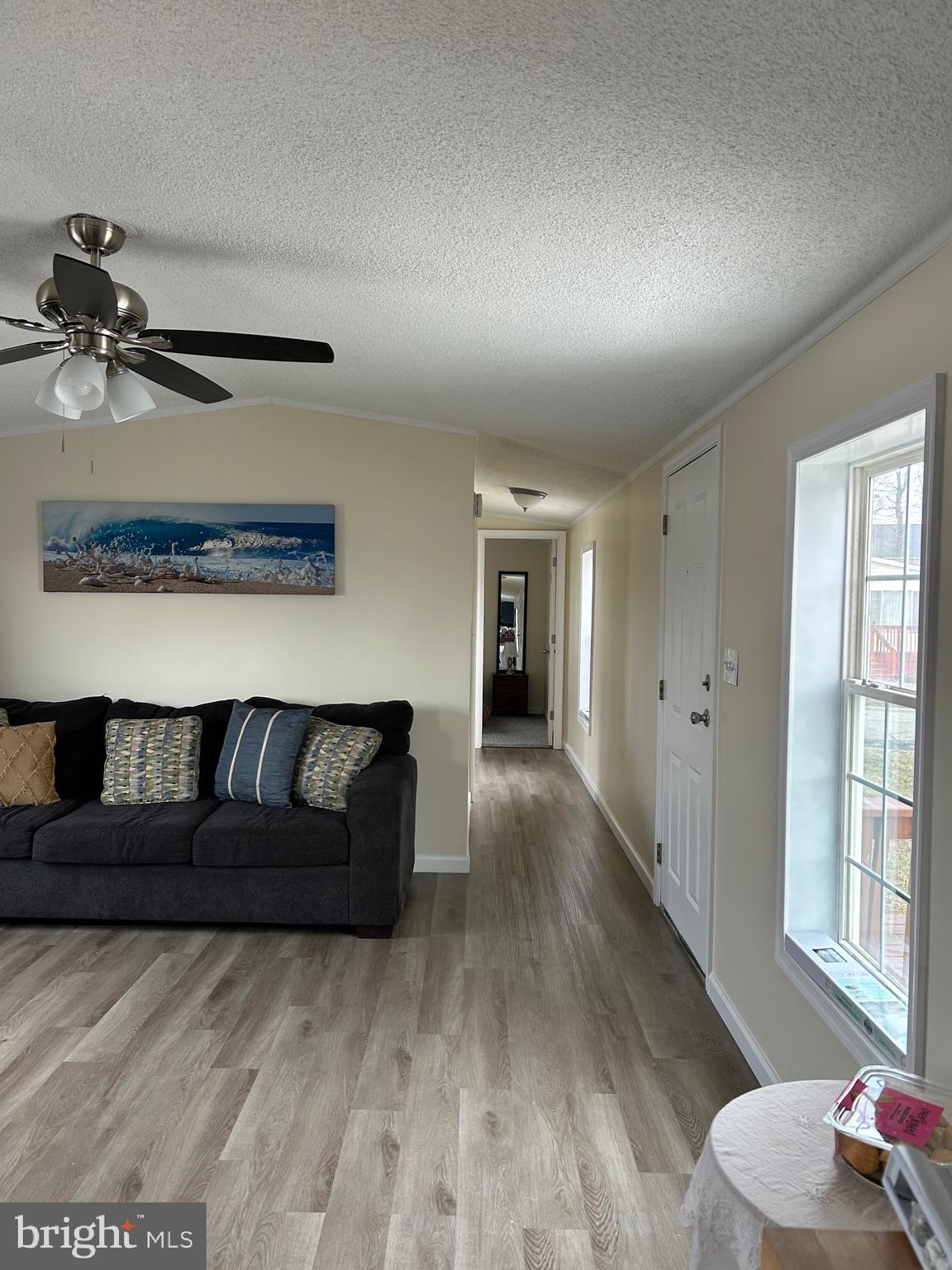 2139 Meredith Way, Unit A679 Bear, DE 19701 - Photo 17 of 38 a living room with furniture and a chandelier