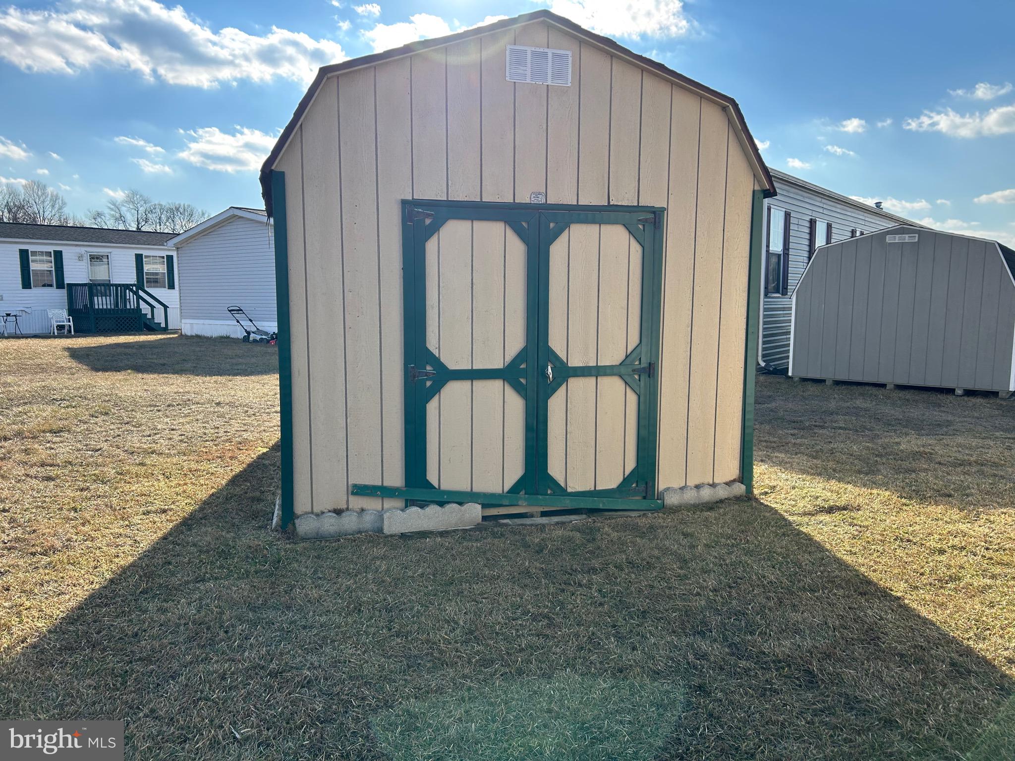 2139 Meredith Way, Unit A679 Bear, DE 19701 - Photo 33 of 38 a view of a small house with roof and wooden fence