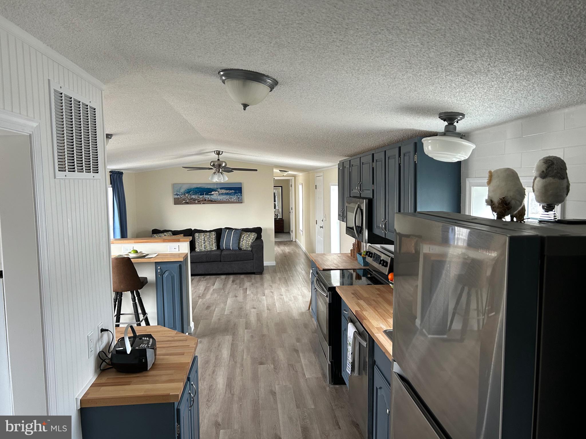 2139 Meredith Way, Unit A679 Bear, DE 19701 - Photo 4 of 38 a living room with furniture and a flat screen tv