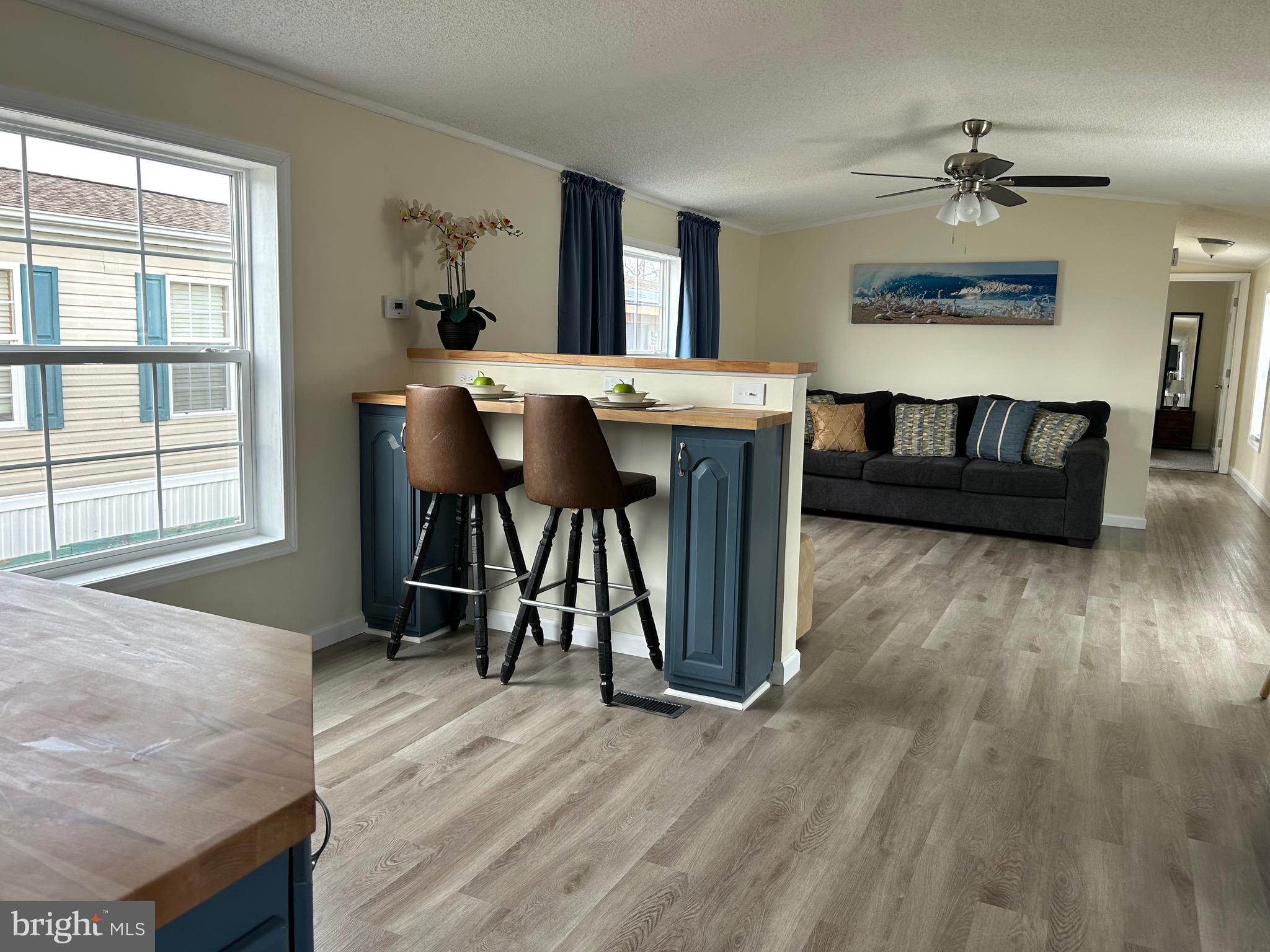 2139 Meredith Way, Unit A679 Bear, DE 19701 - Photo 6 of 38 a living room with furniture and a wooden floor