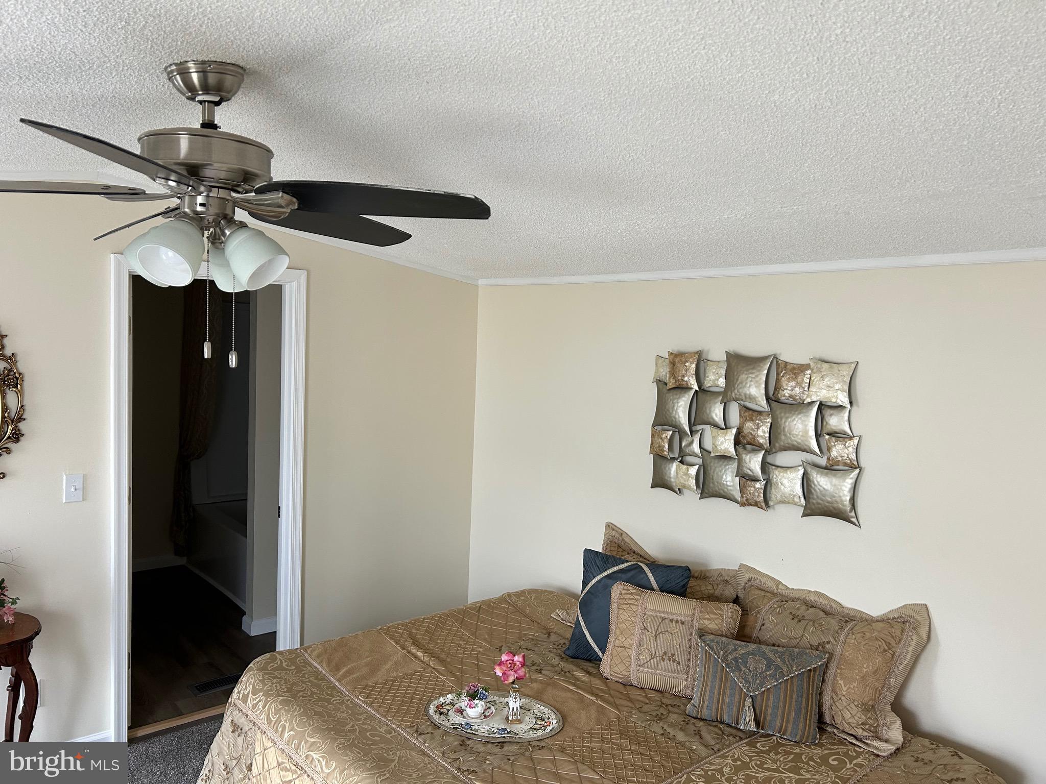 2139 Meredith Way, Unit A679 Bear, DE 19701 - Photo 10 of 38 a bedroom with a bed and a chandelier