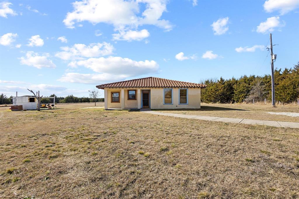 5777 State Highway 160 Whitewright, TX 75491 - Photo 11 of 36 a view of house with yard and sitting area
