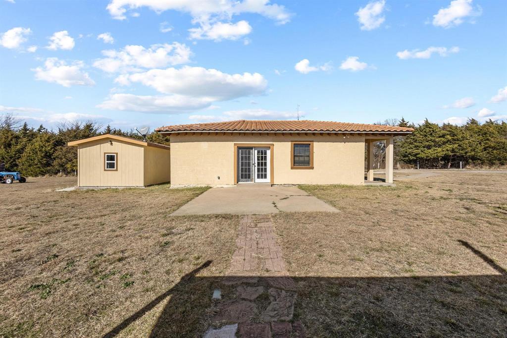 5777 State Highway 160 Whitewright, TX 75491 - Photo 12 of 36 a view of a house with a dry back yard