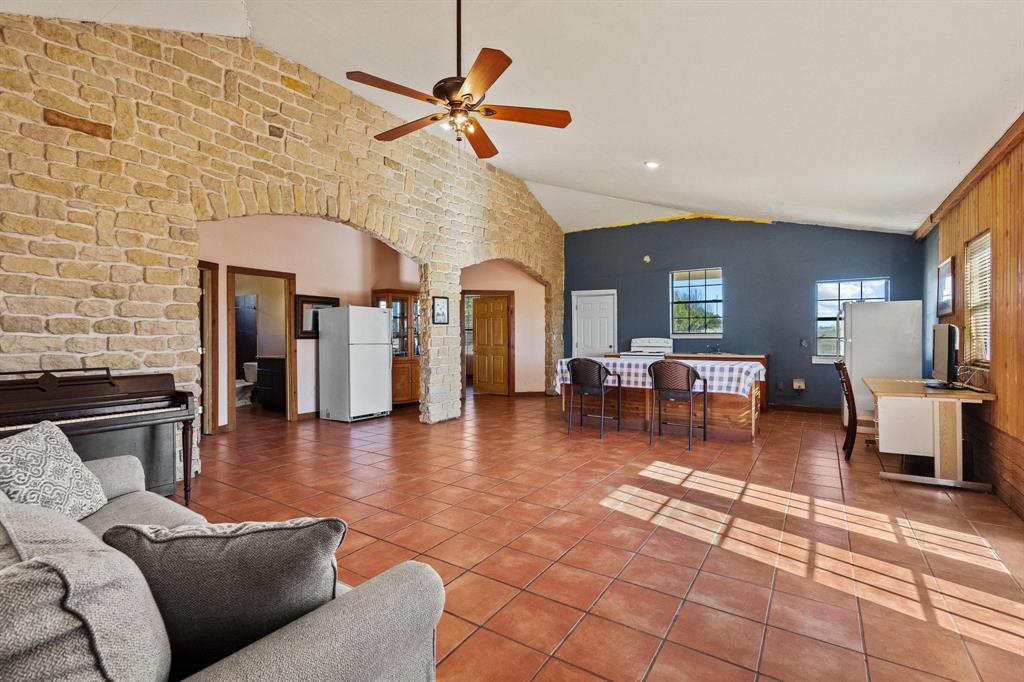 5777 State Highway 160 Whitewright, TX 75491 - Photo 19 of 36 a living room with furniture and a fireplace