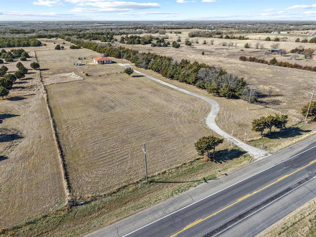 5777 State Highway 160 Whitewright, TX 75491 - Photo 2 of 36 an aerial view of a house