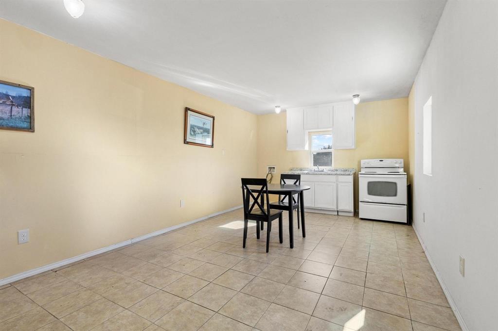 5777 State Highway 160 Whitewright, TX 75491 - Photo 27 of 36 a view of a dining room with furniture and a window