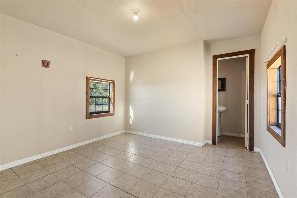 5777 State Highway 160 Whitewright, TX 75491 - Photo 30 of 36 a view of an empty room with a window