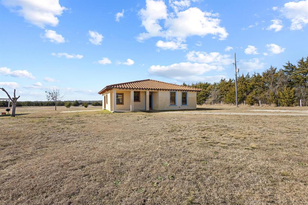 5777 State Highway 160 Whitewright, TX 75491 - Photo 10 of 36 a front view of a house with a yard