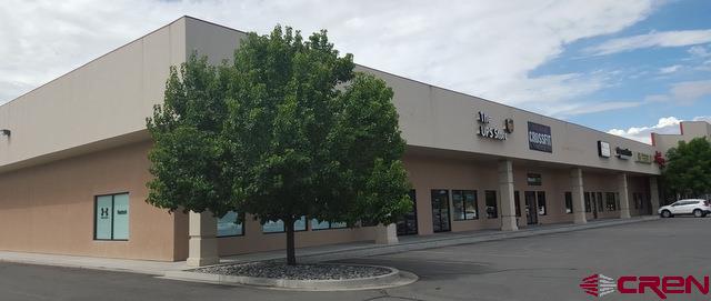 1410 Valley View Drive, Unit 100 Delta, CO 81416 - Photo 2 of 5 a front view of a building with garden