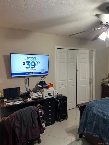 a bedroom with a bed and a desk