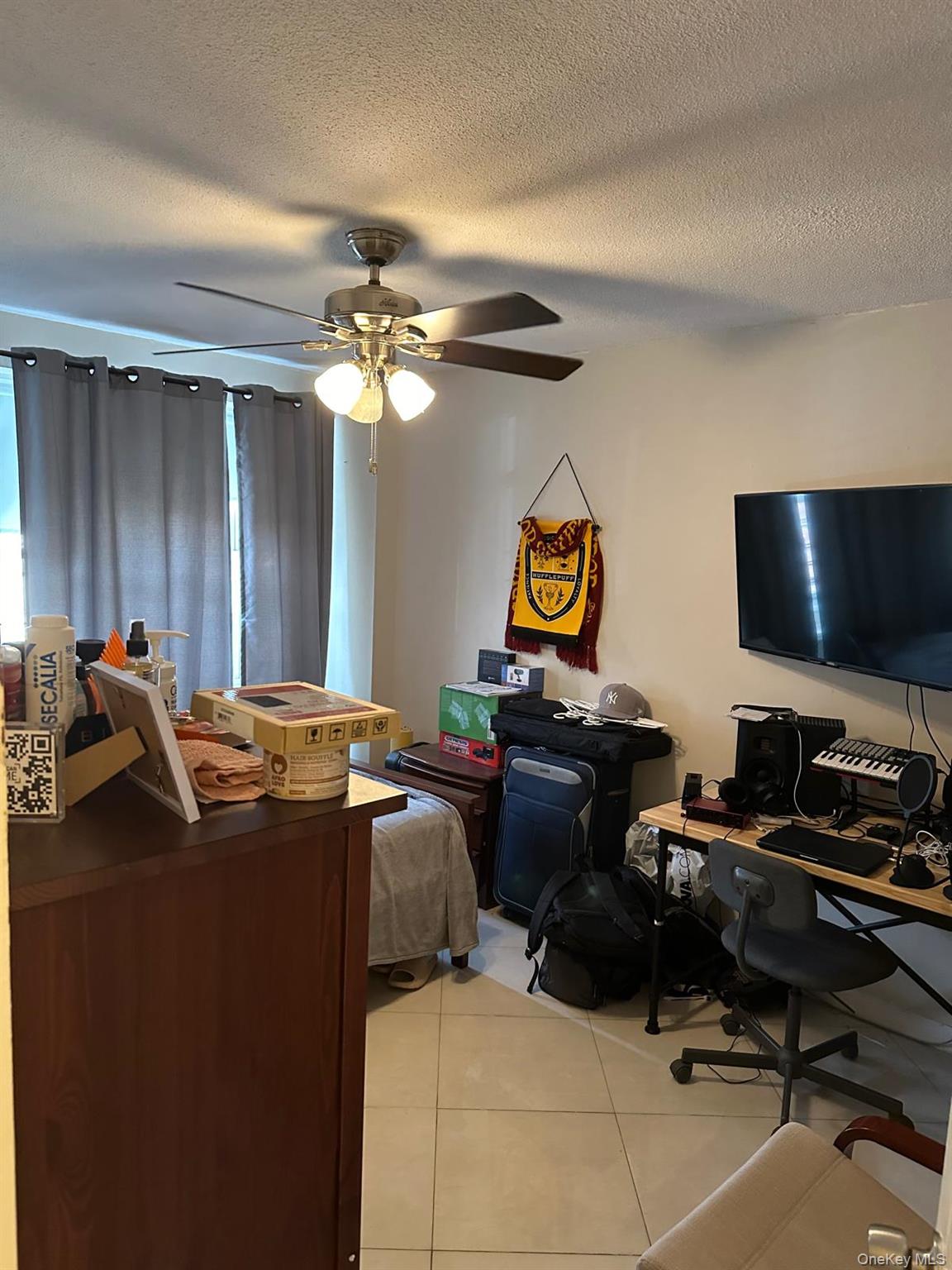 2550 Olinville Avenue, Unit 3D Bronx, NY 10467 - Photo 6 of 11 a view of a workspace with furniture and a window