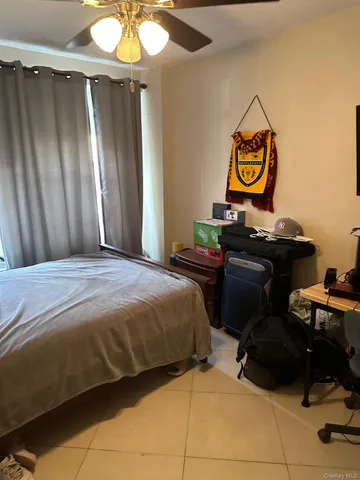 a bedroom with a bed and a table in it