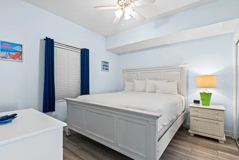 a bedroom with a bed and a dresser