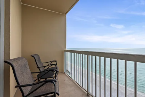 a view of a balcony with furniture