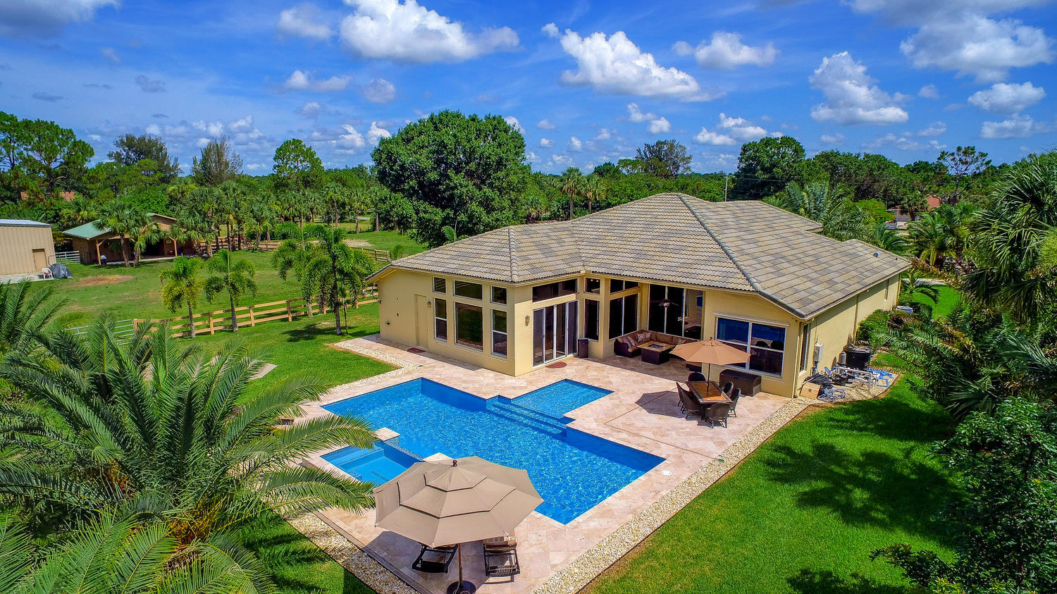 Aerial view of rear pool and patio area