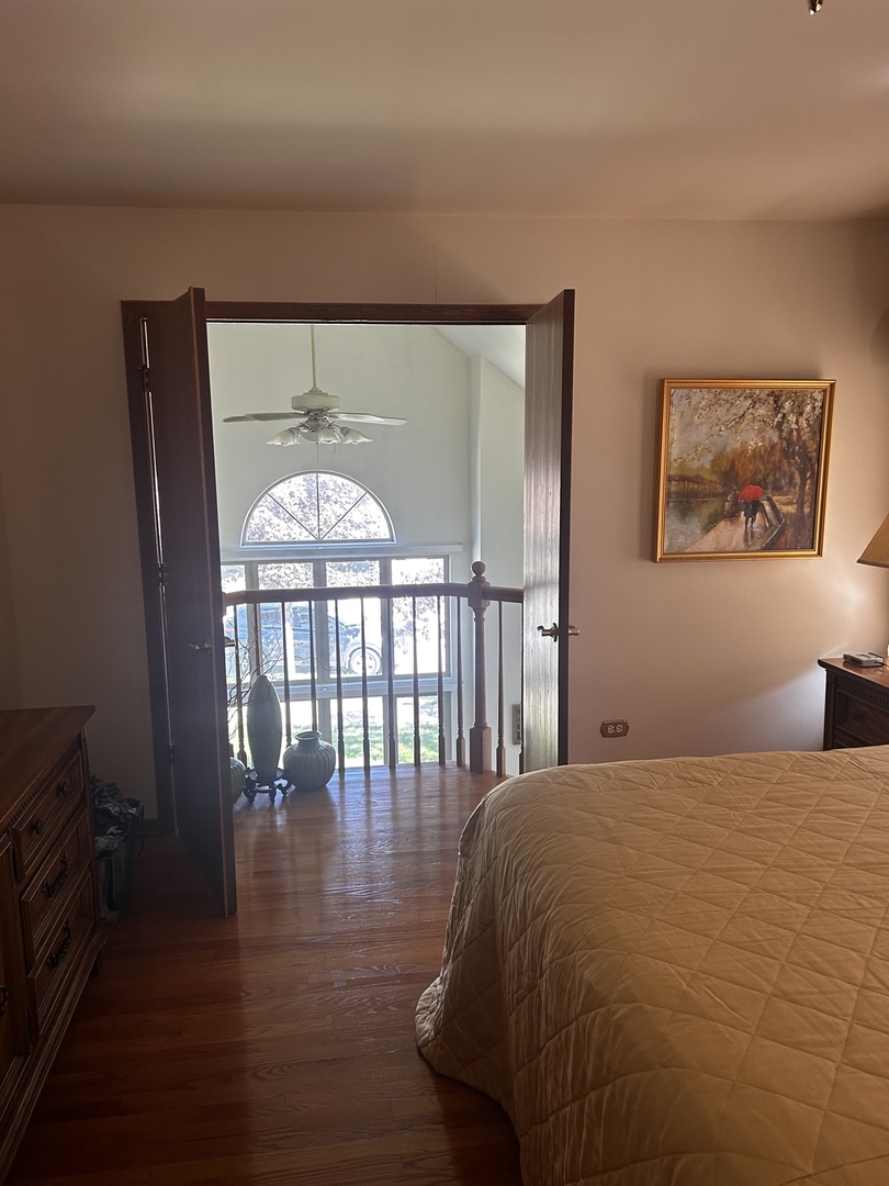 18623 Augusta Lane Hazel Crest, IL 60429 - Photo 12 of 21 a bed sitting in a bedroom next to a window