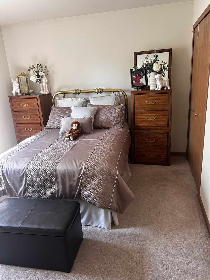 18623 Augusta Lane Hazel Crest, IL 60429 - Photo 18 of 21 a bedroom with a bed and dresser