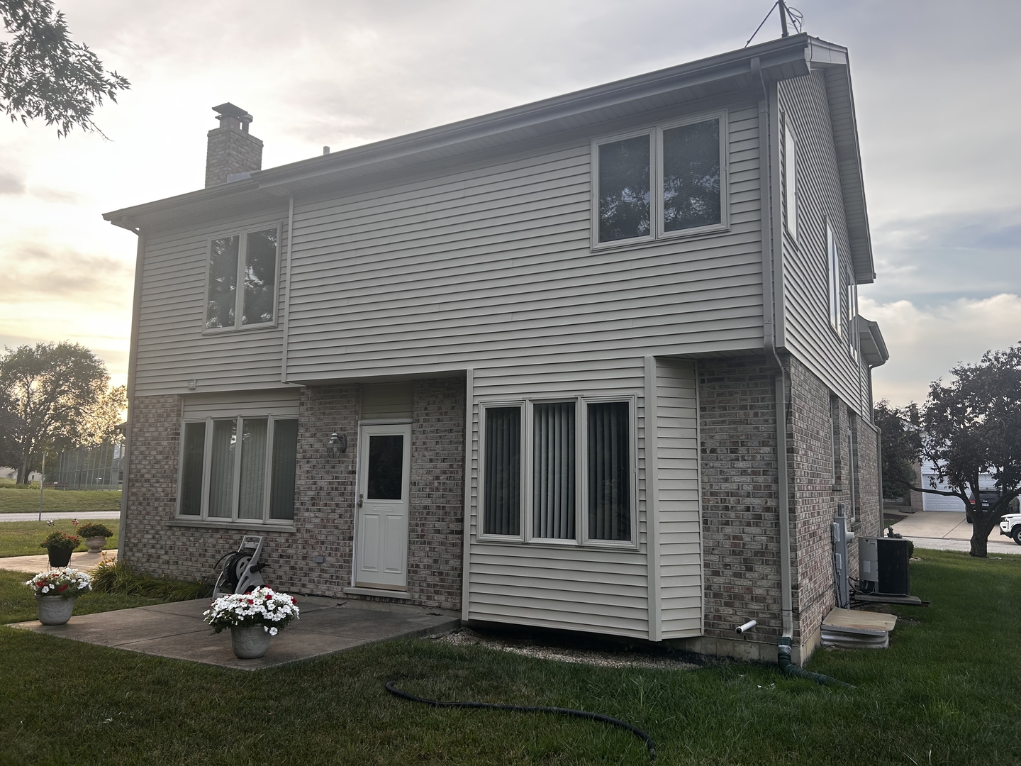 18623 Augusta Lane Hazel Crest, IL 60429 - Photo 3 of 21 a backyard of a house with a garden and barbeque oven