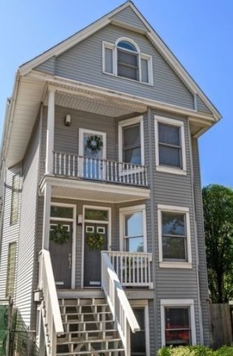 a front view of a house with glass windows