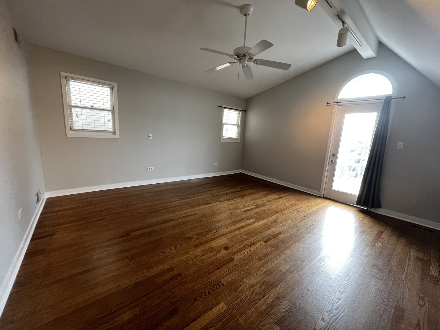 Undisclosed Address Chicago, IL 60657 - Photo 12 of 25 a view of an empty room with wooden floor and a window