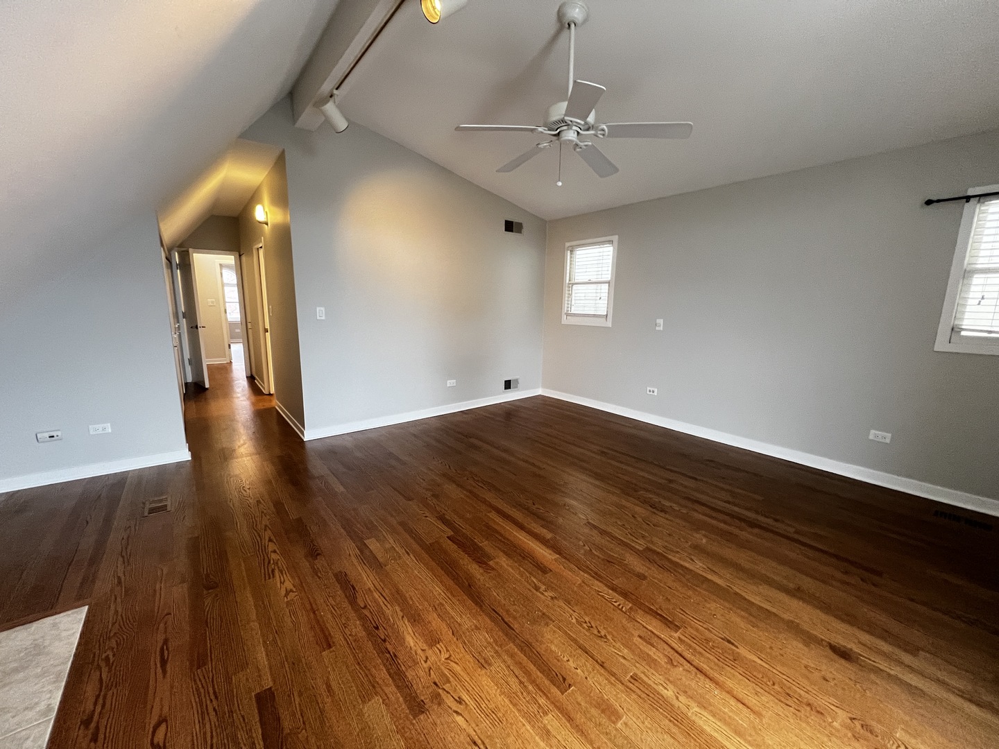 Undisclosed Address Chicago, IL 60657 - Photo 13 of 25 a view of an empty room with wooden floor and a window